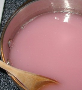 After sugar was added to the violet and lemon juices, the mixture was an opaque pink color that cleared upon boiling.